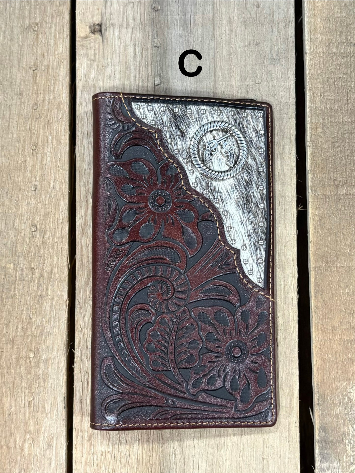 Coffee Brown leather wallet with floral embossing and silver studs on a white background