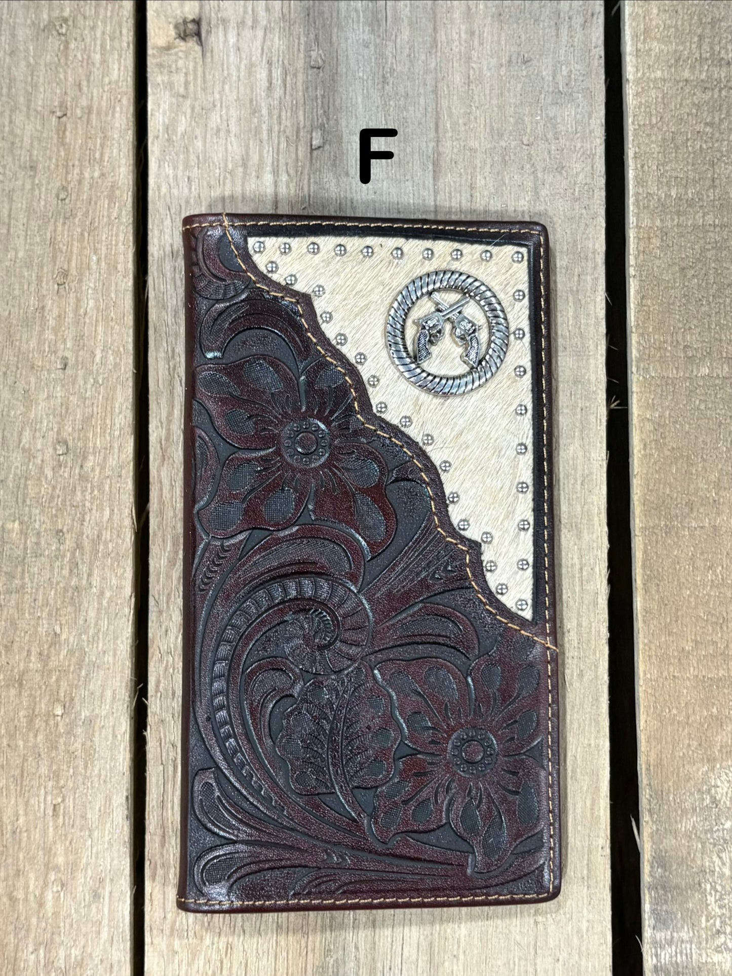 Coffee Brown leather wallet with floral embossing and silver studs on a white background