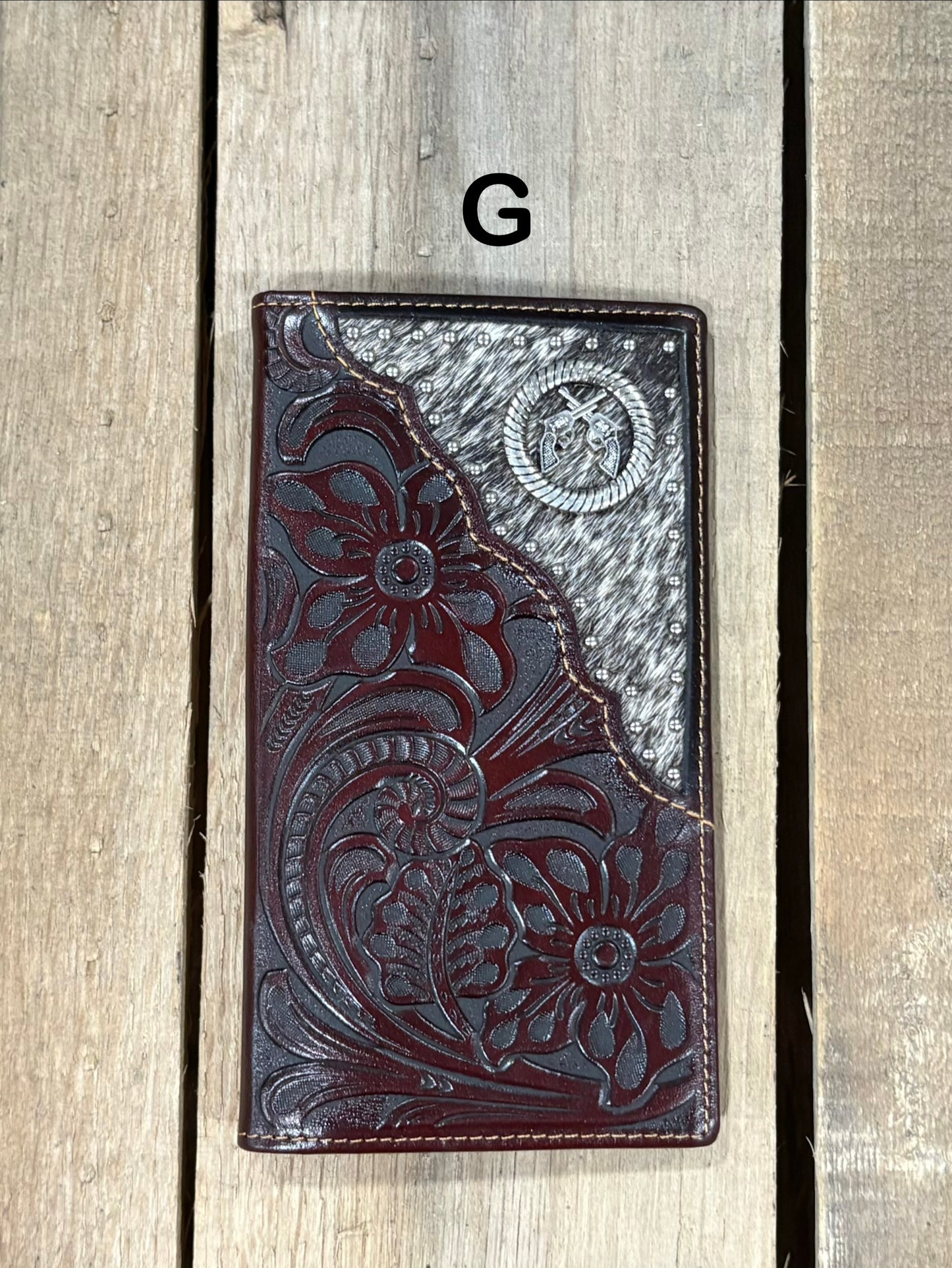Coffee Brown leather wallet with floral embossing and silver studs on a white background
