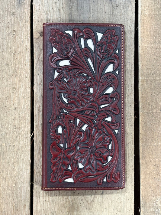 Brown leather wallet with intricate floral turquoise inlay designs on a wooden surface