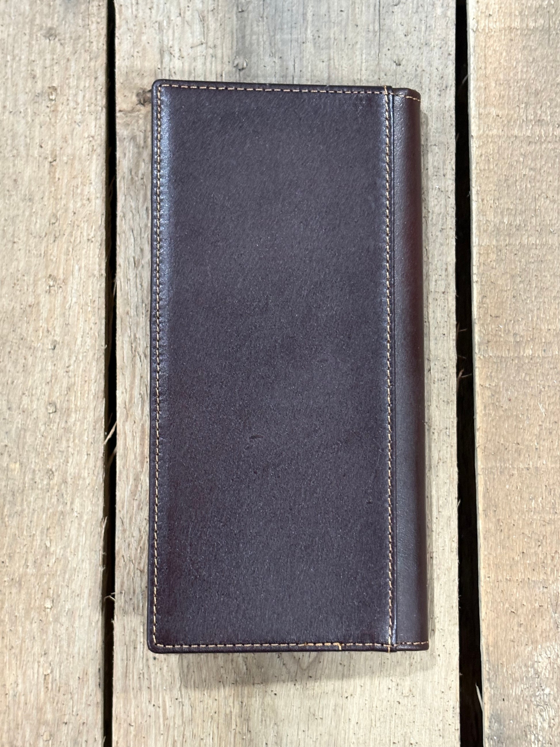 Coffee Brown leather wallet on a wooden surface