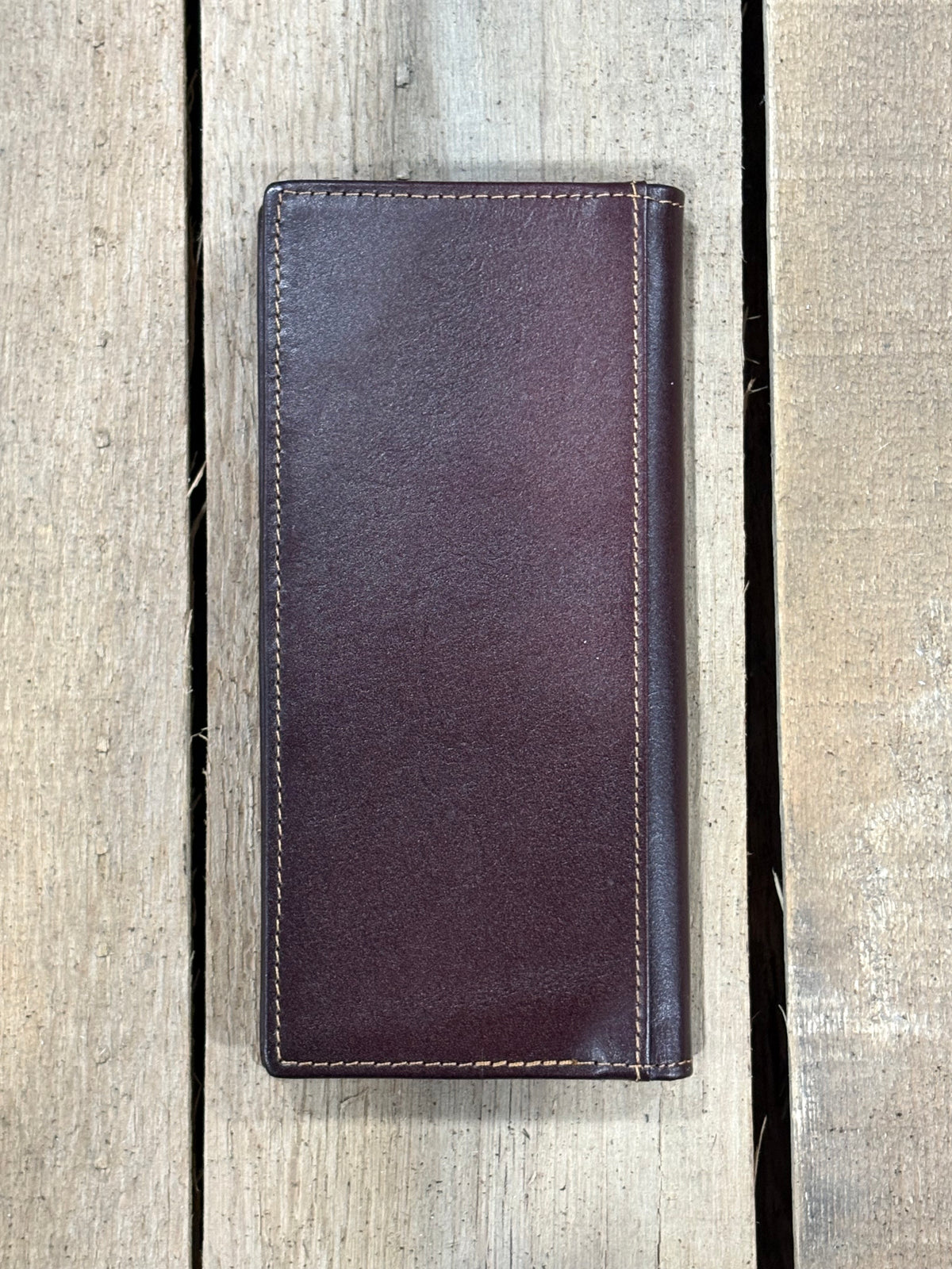 Coffee Brown leather wallet on a wooden surface
