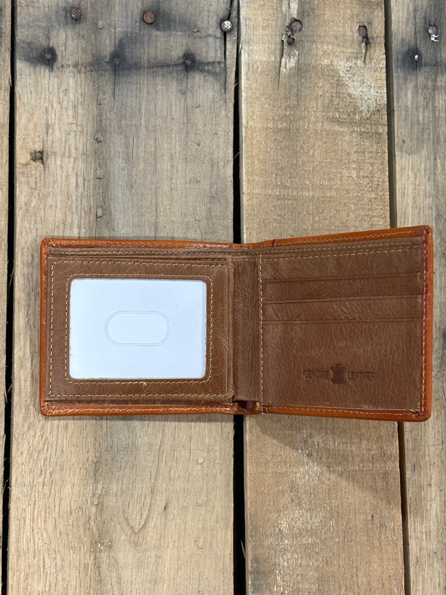 Light Brown leather wallet with three card slots and one ID window slot on a wooden surface