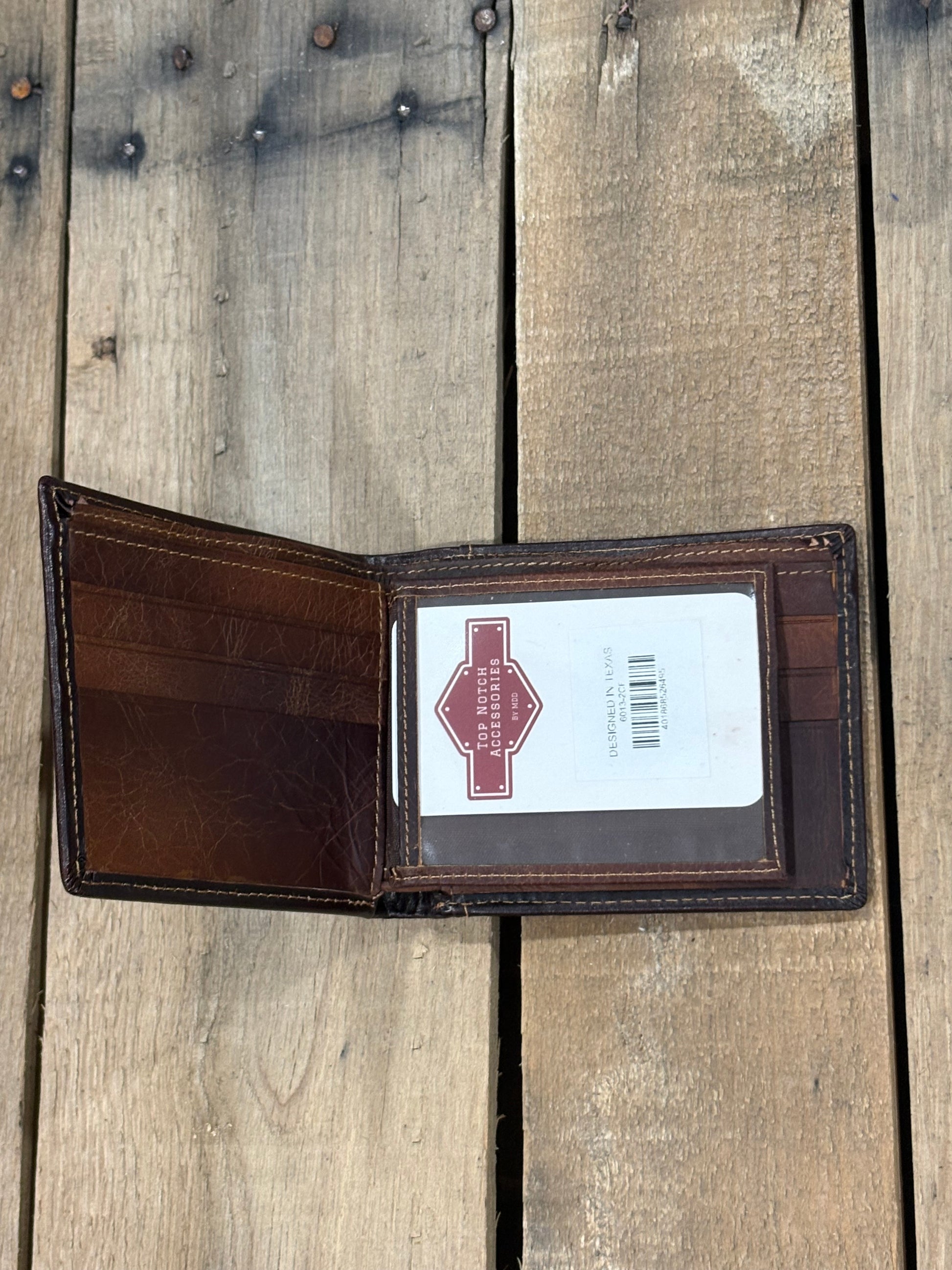 Dark Brown leather wallet with three card slots and one ID window slot on a wooden surface
