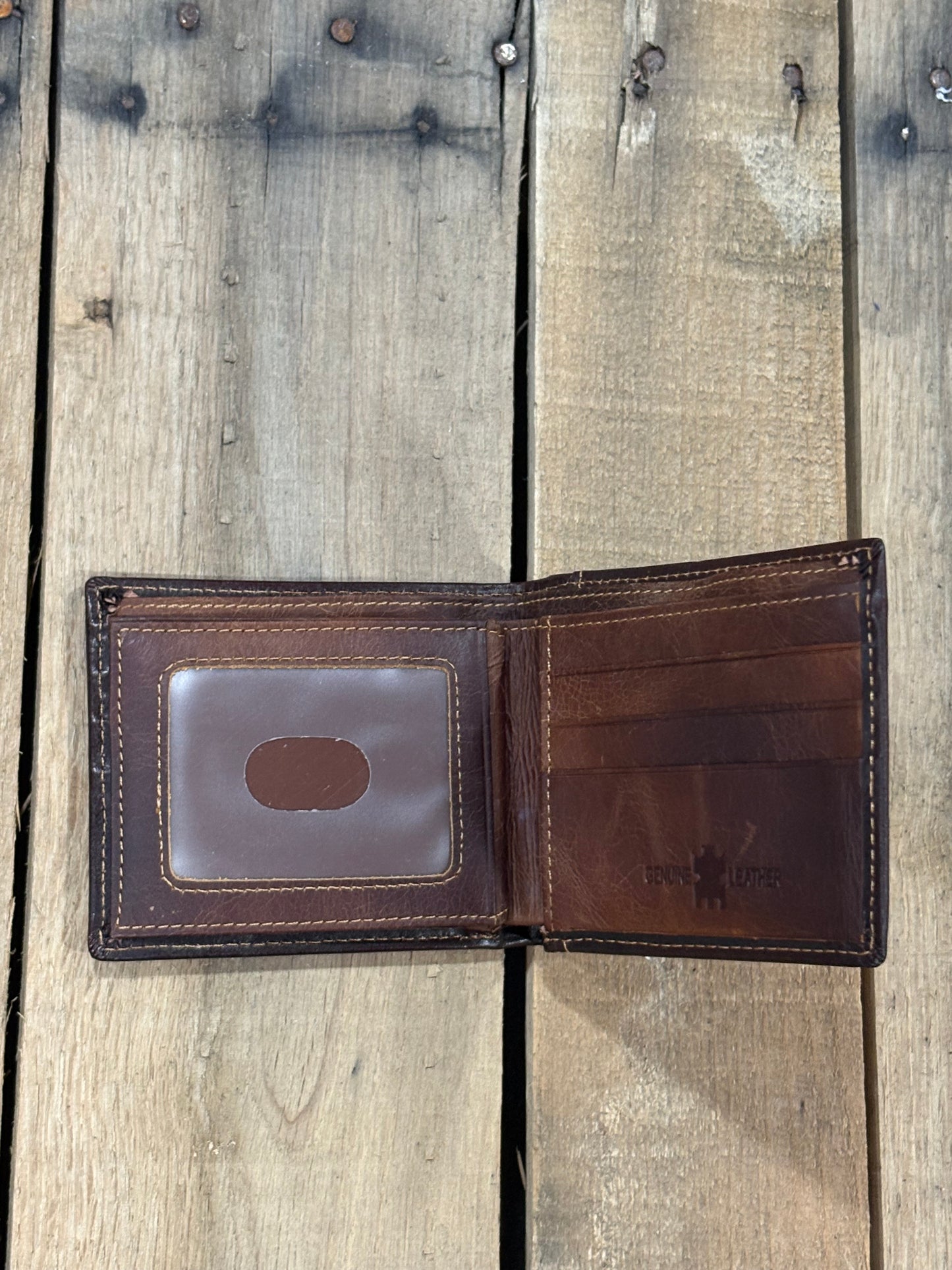 Dark Brown leather wallet with three card slots and one ID window slot on a wooden surface