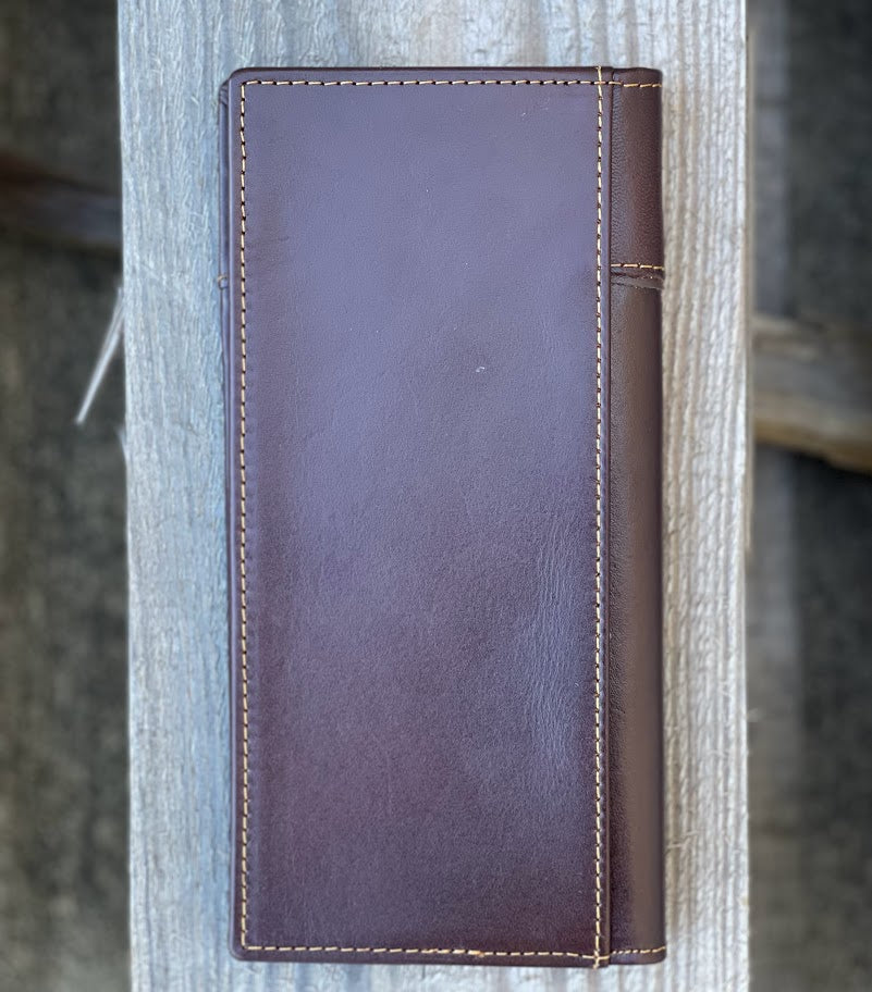 Coffee Brown leather wallet with visible stitching on a wooden surface