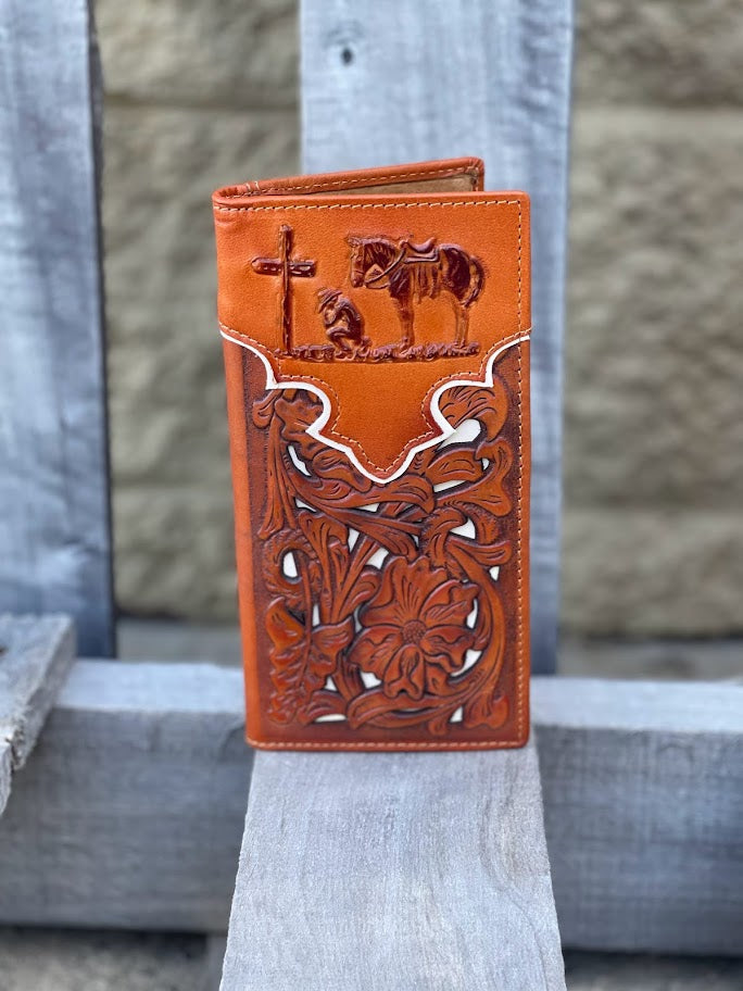 Light Brown leather wallet with intricate designs on a stone surface
