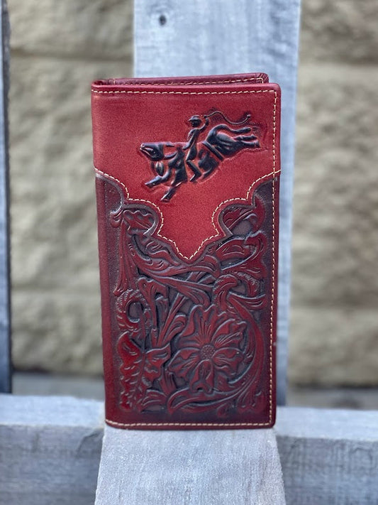 Brown leather wallet with intricate designs on a wooden surface