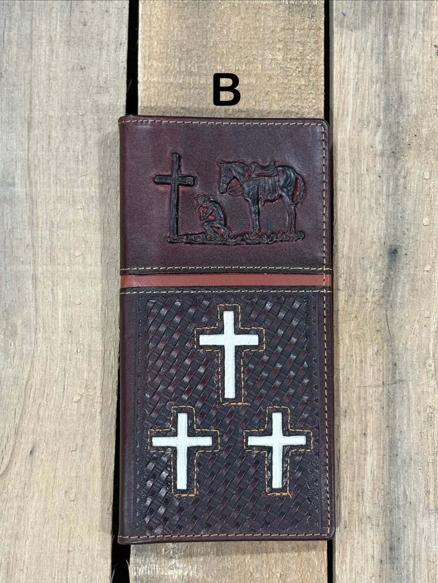 Coffee Brown leather cover with embossed designs of crosses and a horse, featuring metal cross symbols.