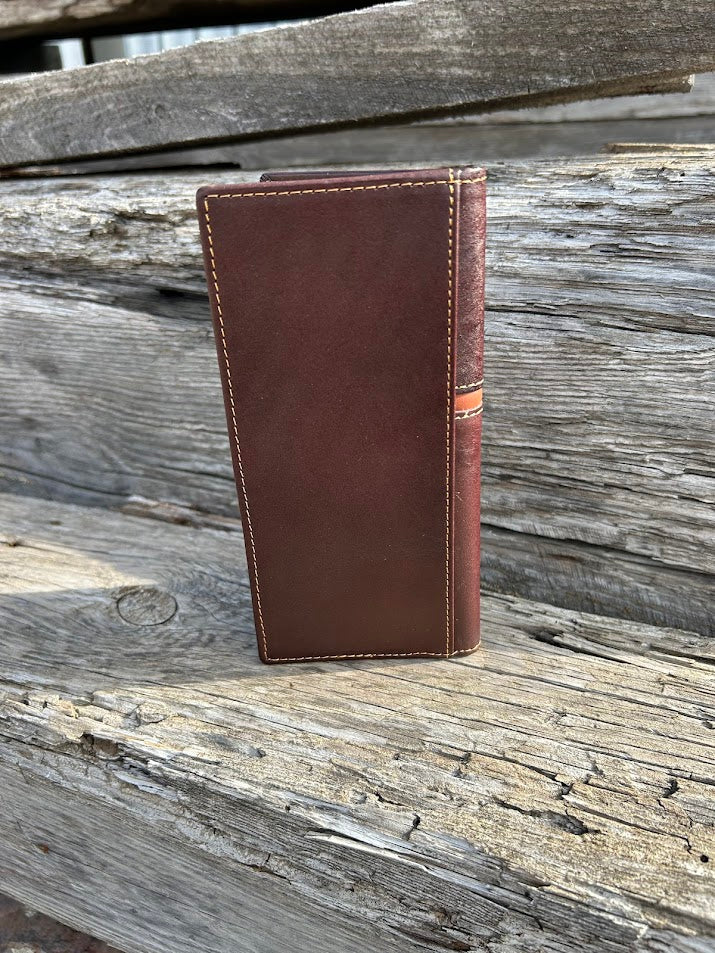 Coffee Brown leather wallet on a wooden surface