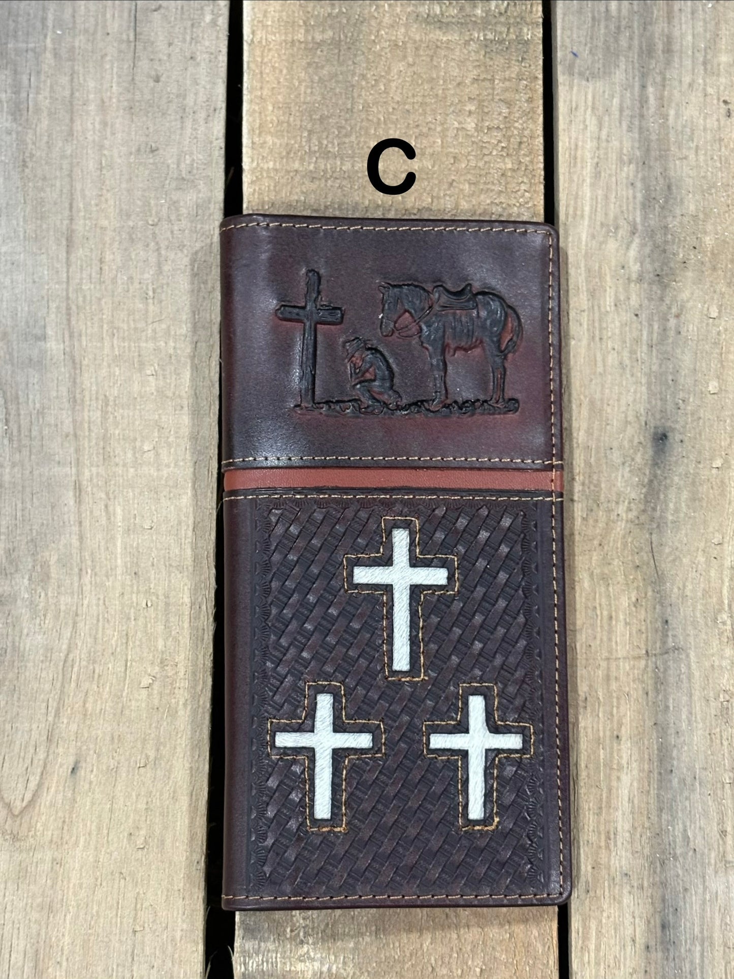 Coffee Brown leather cover with embossed designs of crosses and a horse, featuring metal cross symbols.