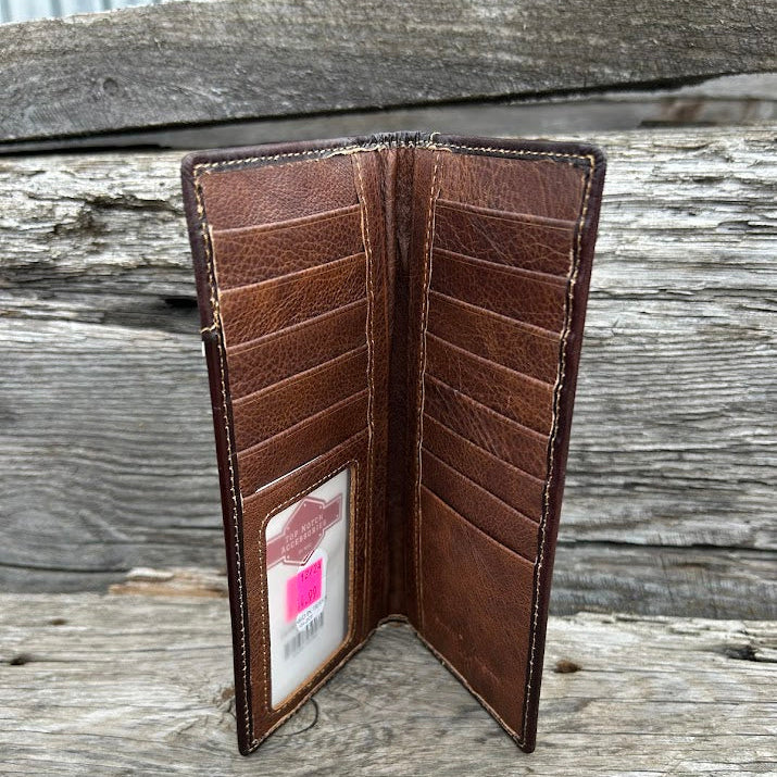 Brown leather wallet open on a wooden surface