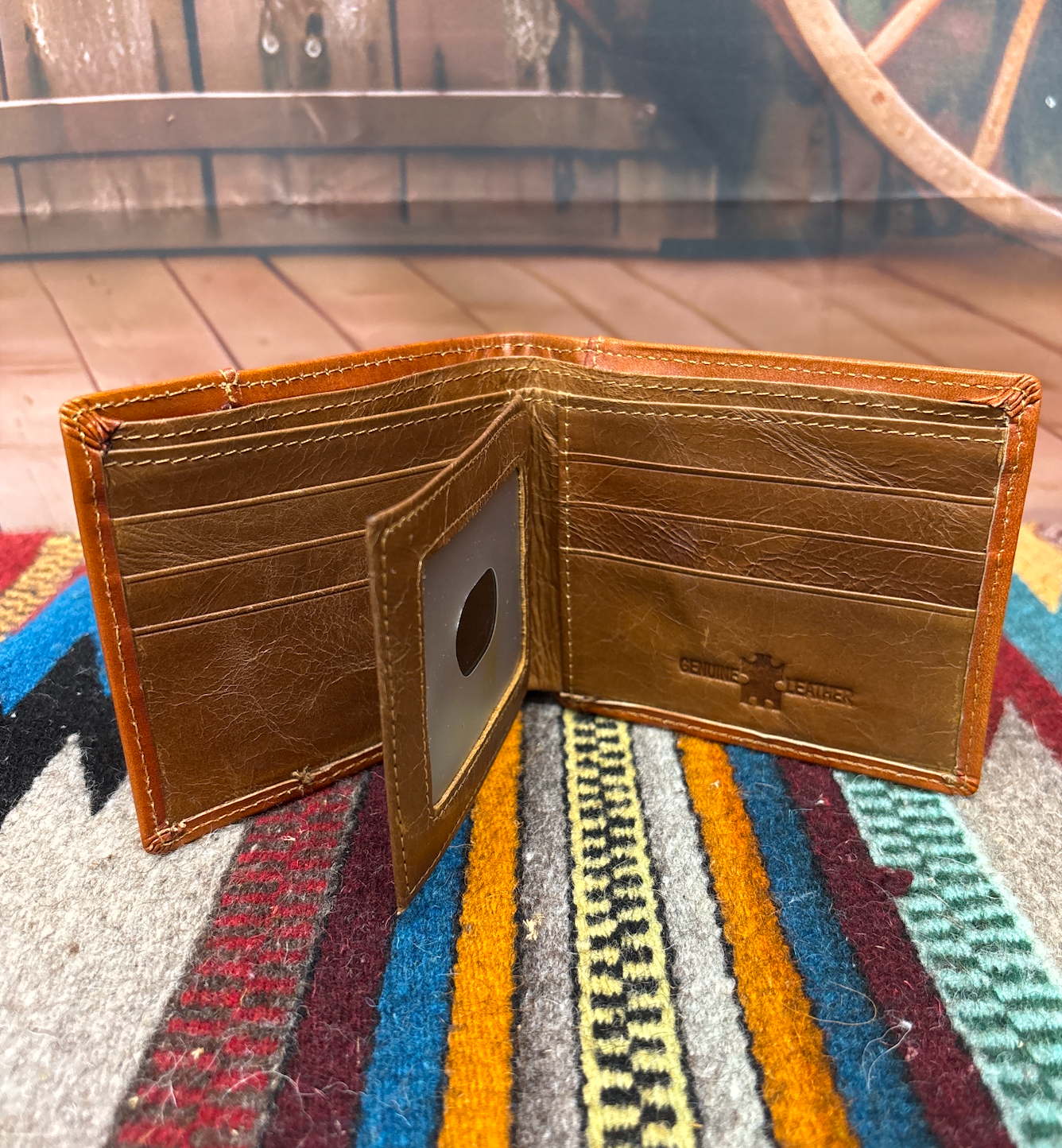 This Brown leather bifold wallet. Inside view showing multiple card slots, and a dual ID window. 