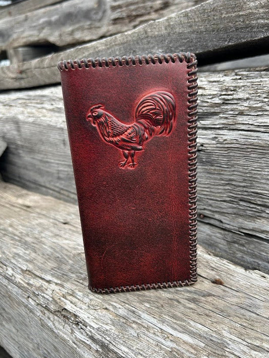 Brown leather checkbook wallet with a embossed rooster design and a whip stitched border. Front View