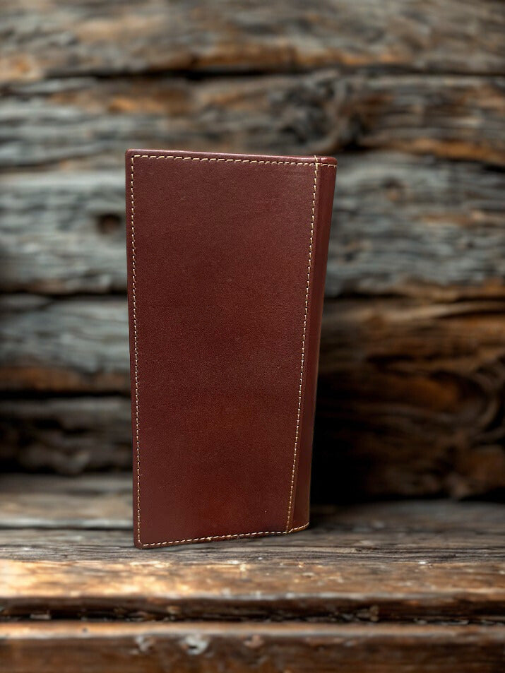 Brown leather wallet on a wooden surface with a rustic background
