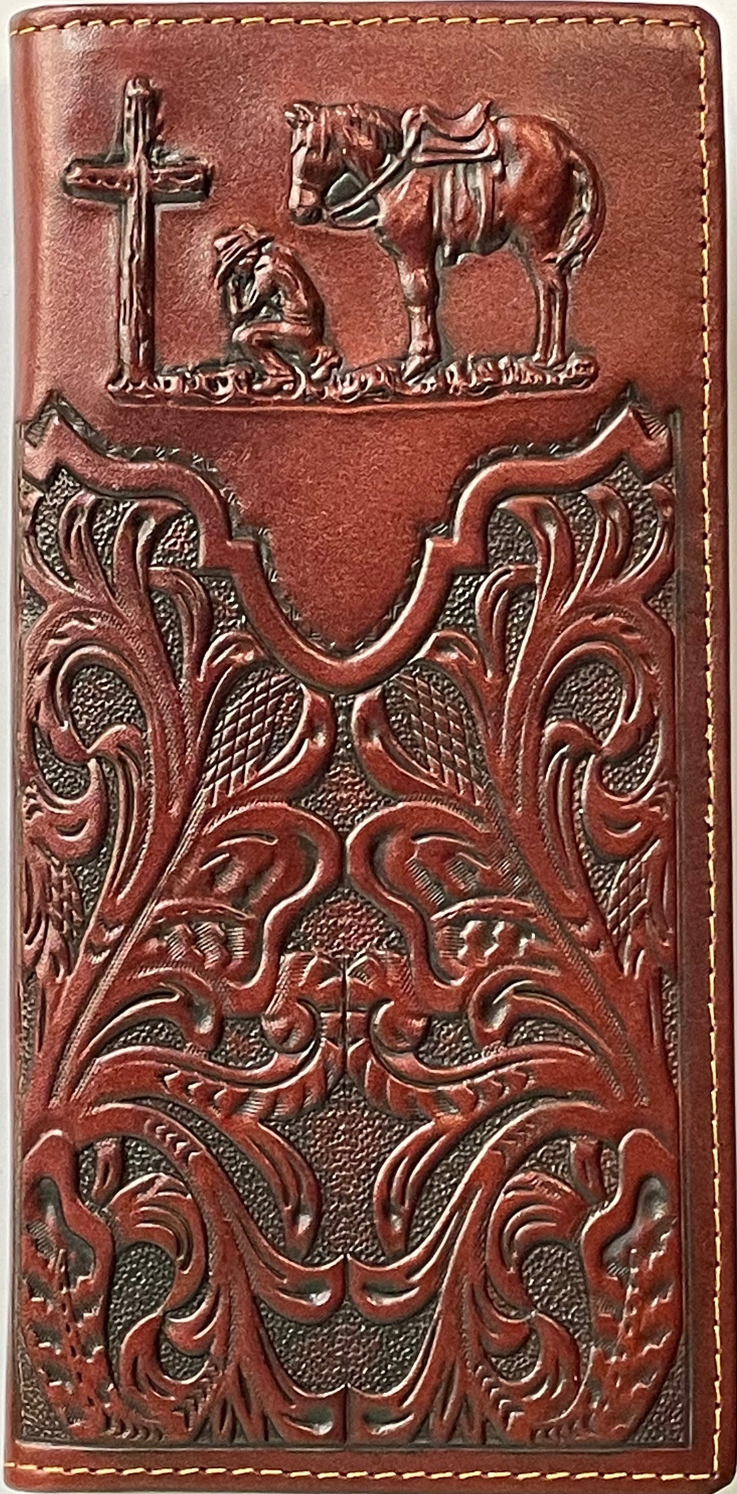 Brown leather wallet with intricate patterns and horse and cross design