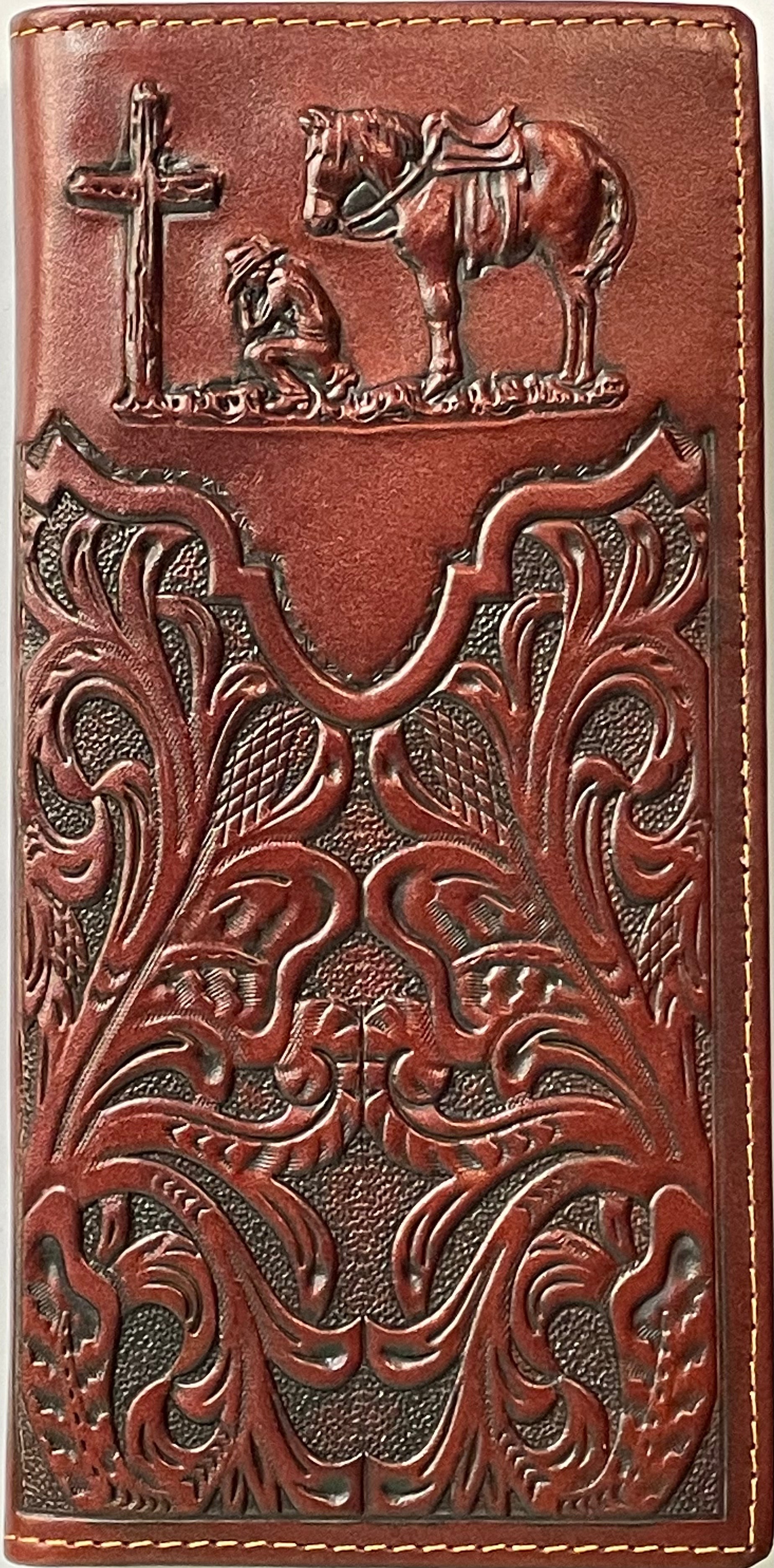 Brown leather wallet with intricate patterns and horse and cross design