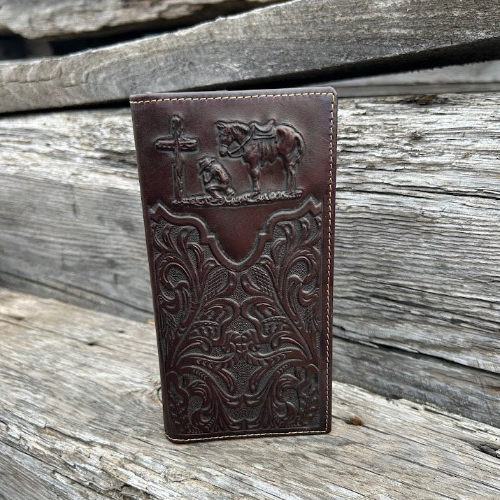 Coffee Brown leather wallet with embossed designs on a wooden surface