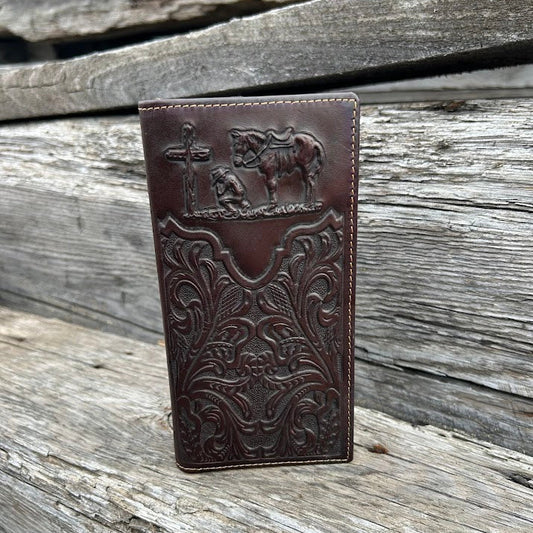 Coffee Brown leather wallet with embossed designs on a wooden surface