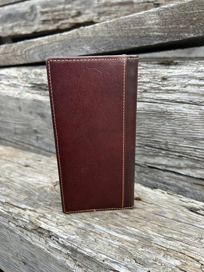 Coffee Brown leather wallet on a wooden surface