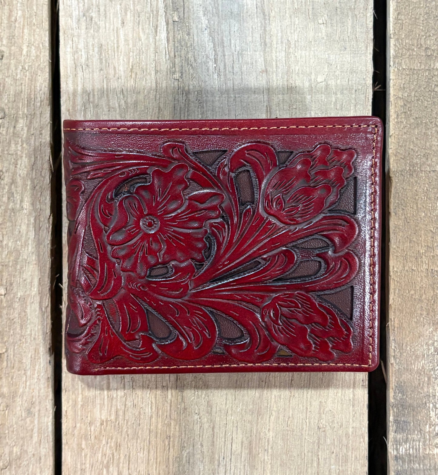 Brown leather wallet with intricate floral embossing