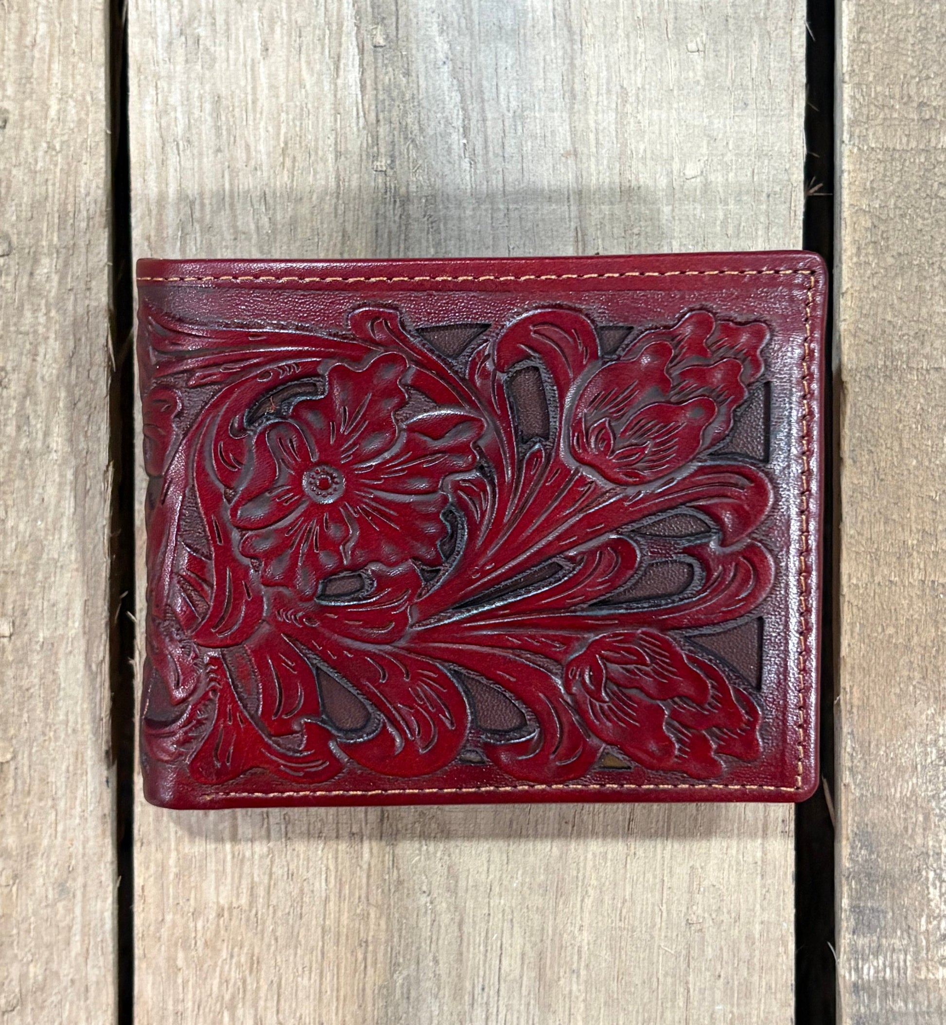 Brown leather wallet with intricate floral embossing
