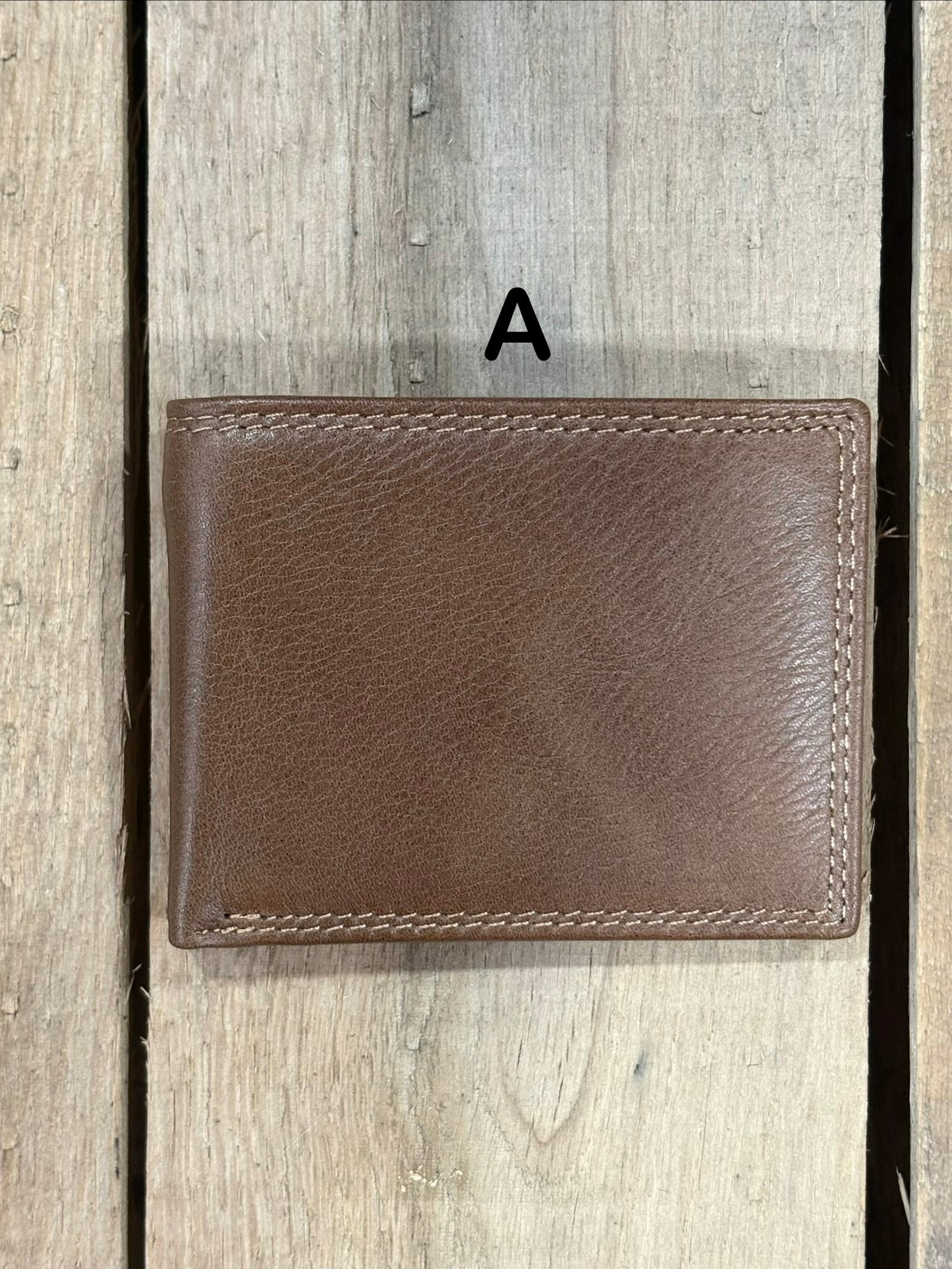 Coffee Brown smooth leather wallet on a wooden surface