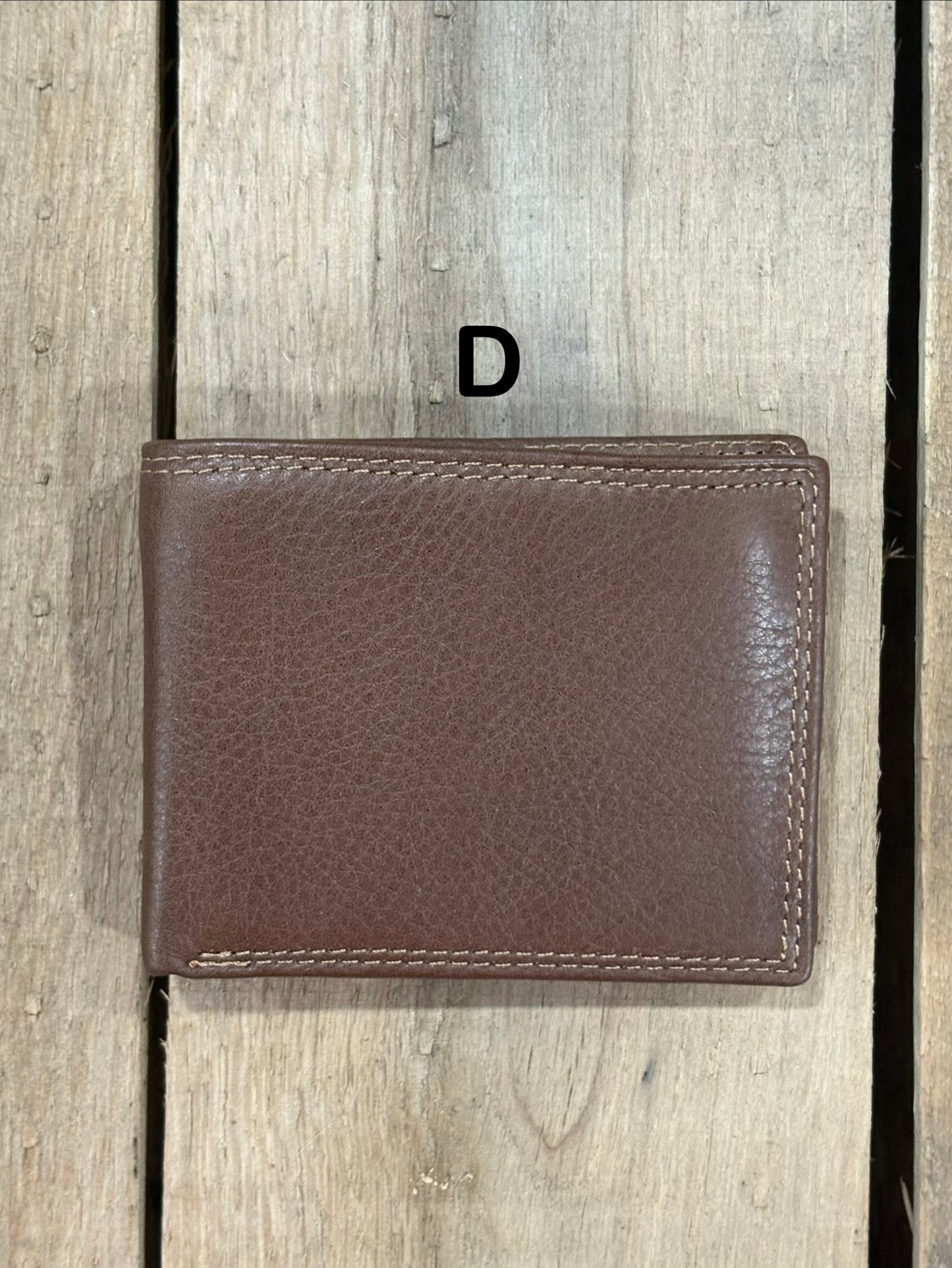 Coffee Brown smooth leather wallet on a wooden surface