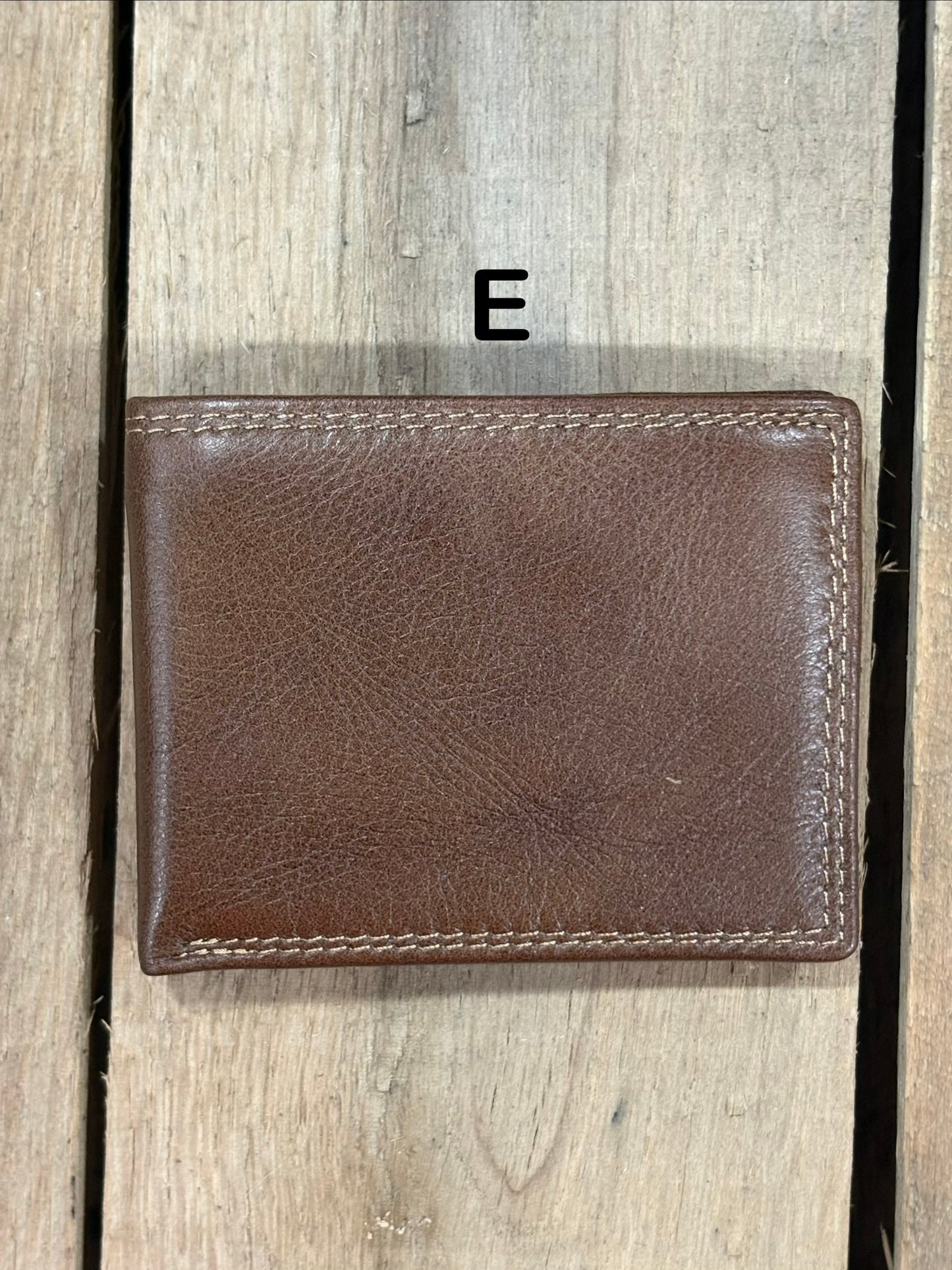 Coffee Brown smooth leather wallet on a wooden surface