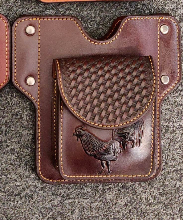 Coffee Brown leather holster with embossed Rooster design on a gray surface