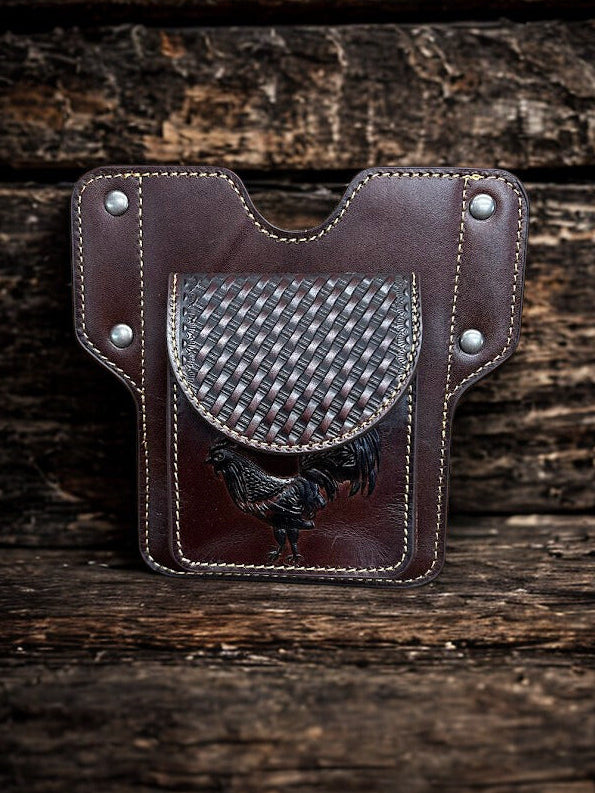 Coffee Brown leather pouch with silver studs on a wooden surface