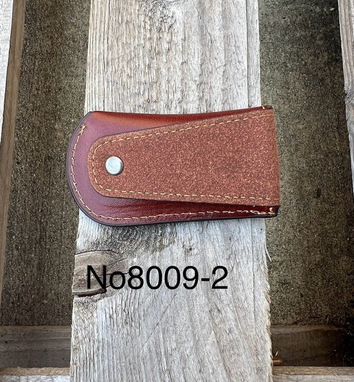 This Brown leather knife sheath from Top Notch Accessories features an embossed Longhorn with Star design. Rear view showing leather belt attachment. 