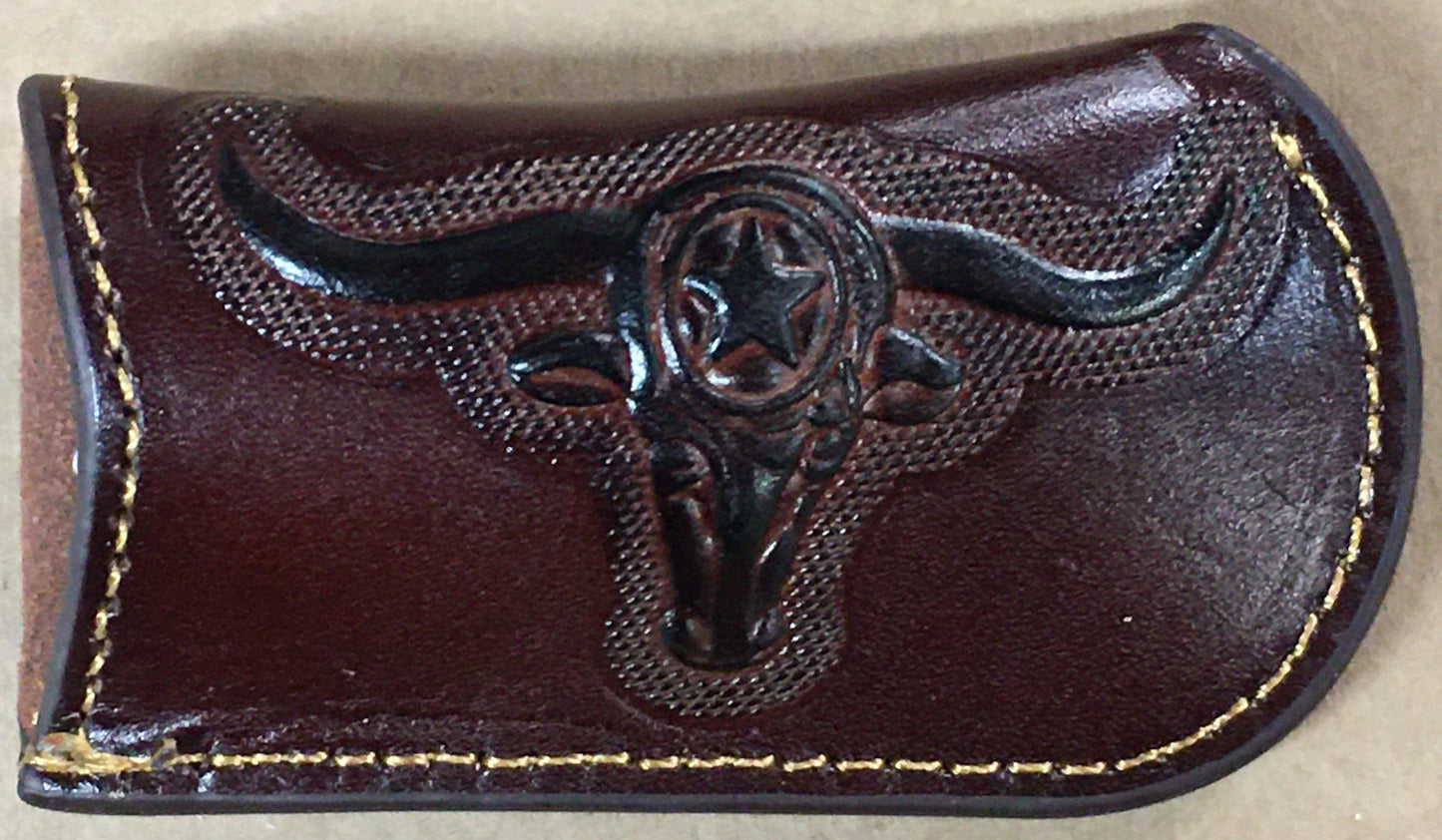 Coffee brown leather money clip with bull head design on a beige background