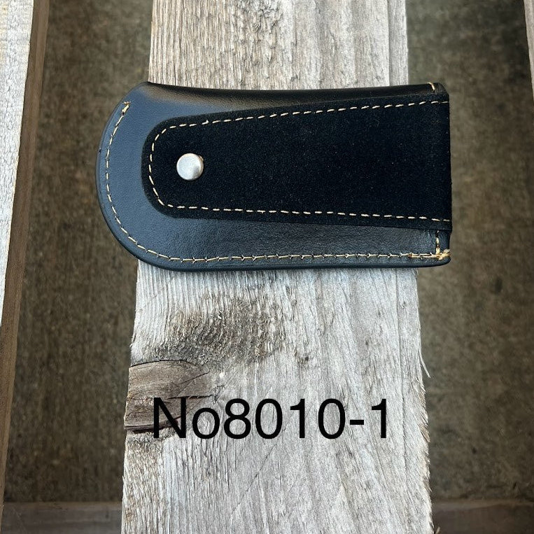 This Black leather knife sheath from Top Notch Accessories features an embossed Praying Cowboy design. Rear view showing leather belt attachment. 