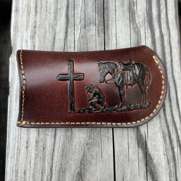 This Coffee Brown leather knife sheath from Top Notch Accessories features a embossed praying cowboy design. Front View