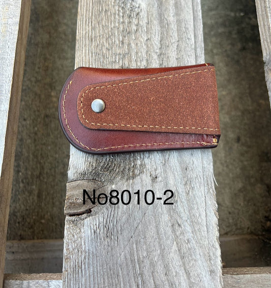 This Brown leather knife sheath from Top Notch Accessories features a embossed Praying Cowboy design. Rear view showing leather belt attachment. 