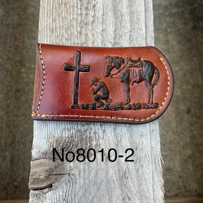 This Brown leather knife sheath from Top Notch Accessories features a embossed Praying Cowboy design. Front View