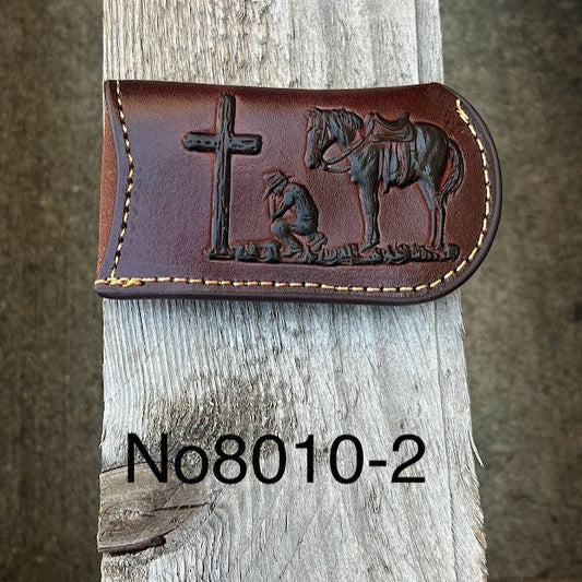 This Coffee Brown leather knife sheath features a embossed Praying Cowboy design. Front View