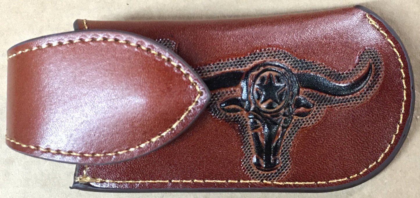 Brown leather belt with bull head emblem on a beige background