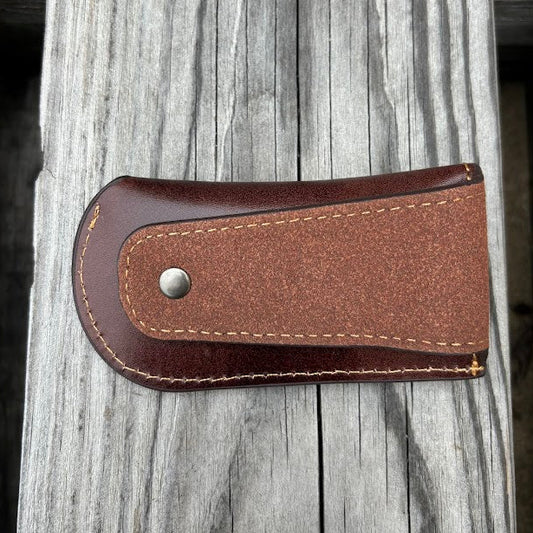 This Coffee Brown leather knife sheath with a Praying Cowboy design on it has a keep closure. Rear view showing leather belt loop attachment. 