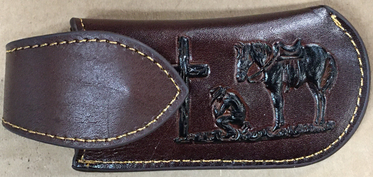 Coffee Brown leather sheath with embossed design on a beige background