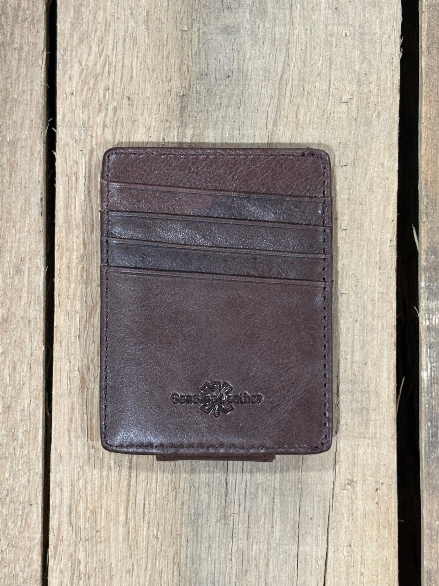 A Coffee brown full grain leather money clip from Top Notch Accessories, featuring six total card slots. 