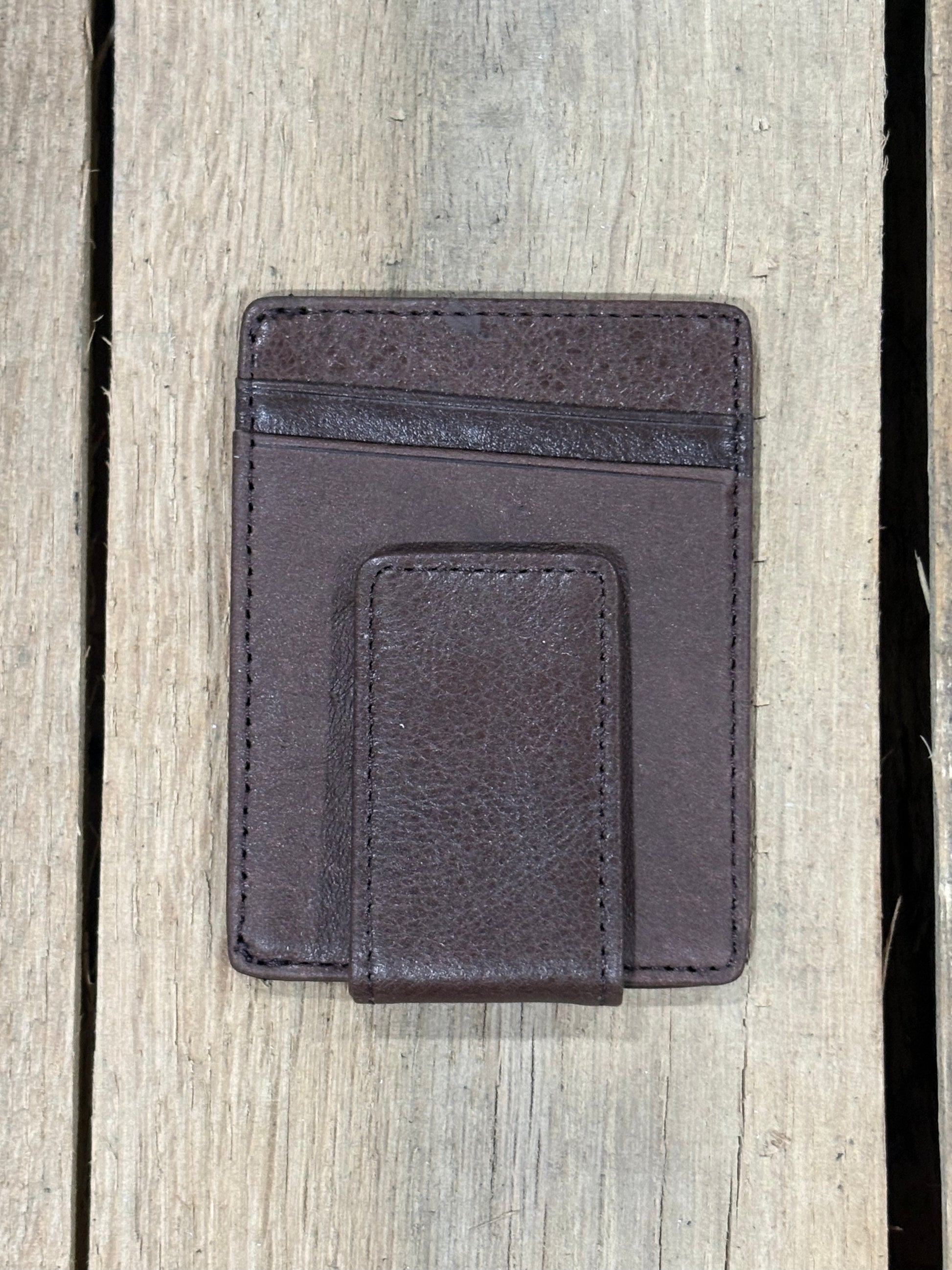 Coffee Brown leather magnetic money clip wallet on a wooden surface