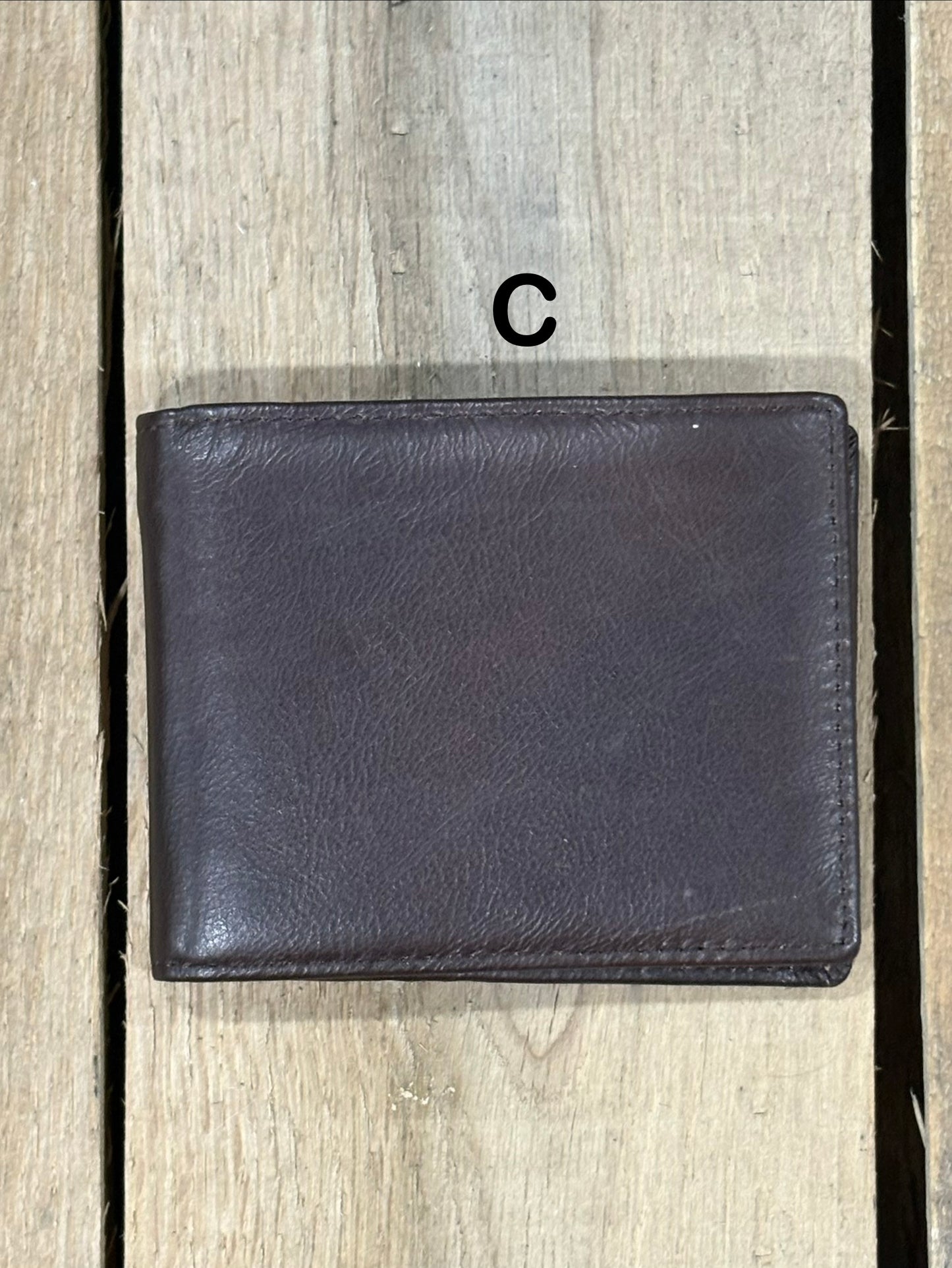 Dark Brown smooth leather wallet on a wooden surface