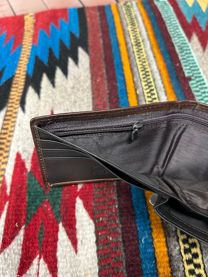 Inside view of bill compartment showing zippered bill pocket. 