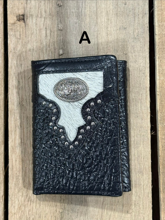 Black leather alligator print wallet with hairon cowhide and silver rooster concho on a wooden surface