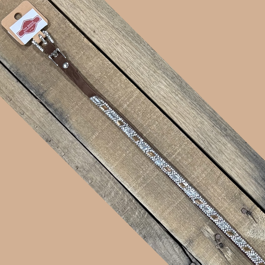 Long coffee brown hat band with clear and brown diamond sequence on a wooden surface