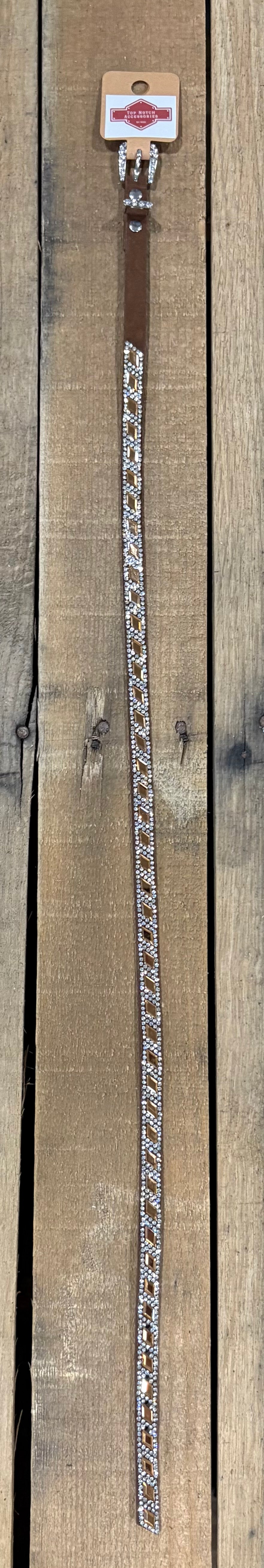 Long coffee brown hat band with brown diamond sequence on a wooden surface