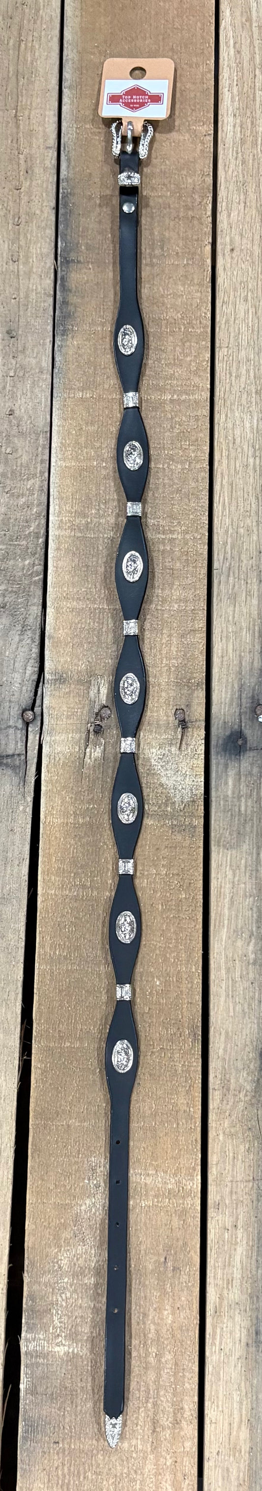 Black western leather hat band with a Horse head concho separated by Silver bands. 