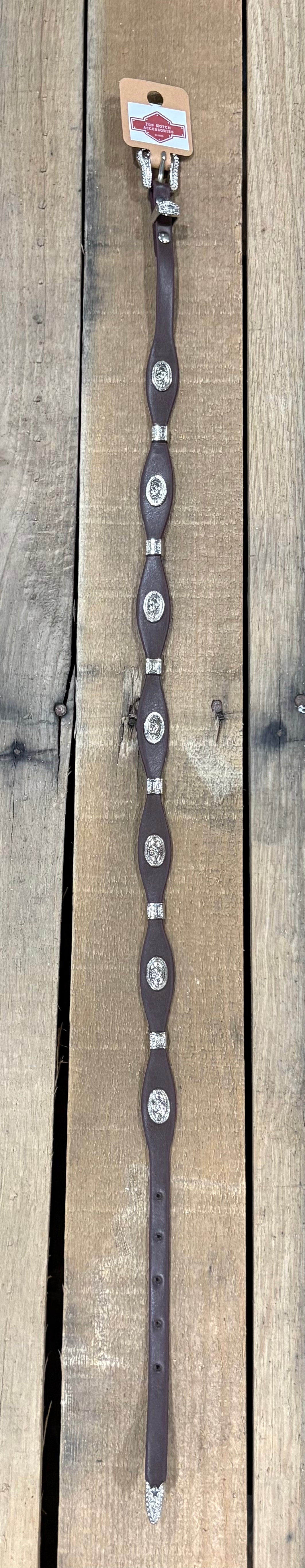 Coffee brown western leather hat band with a Horse head concho separated by Silver bands. 